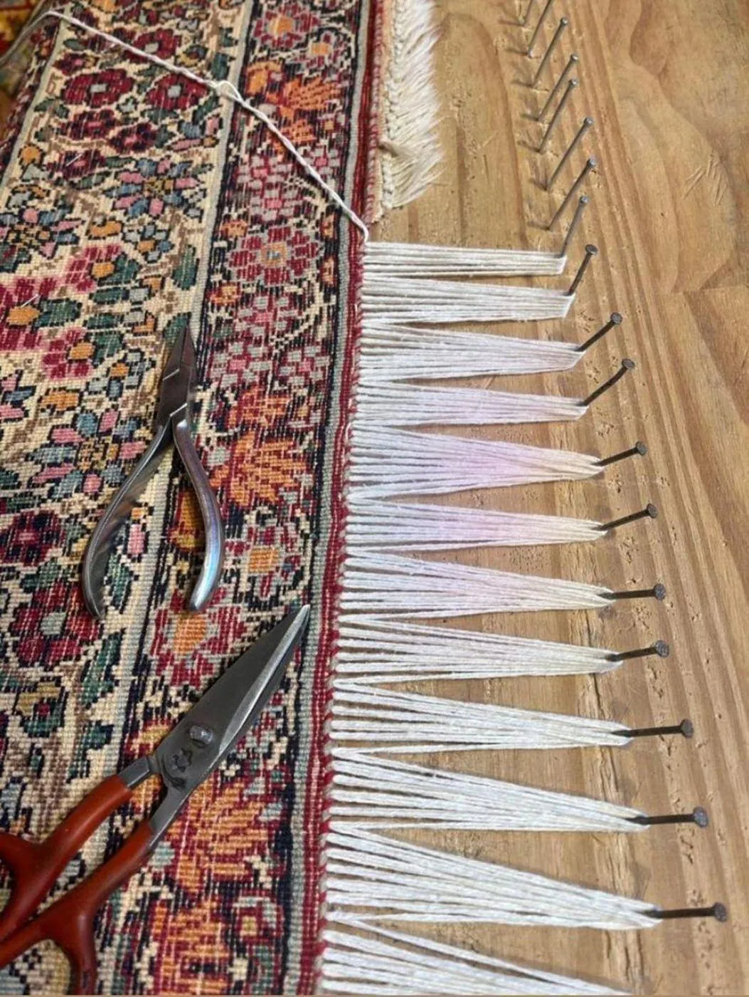 Tapis d'Orient confié à l'atelier